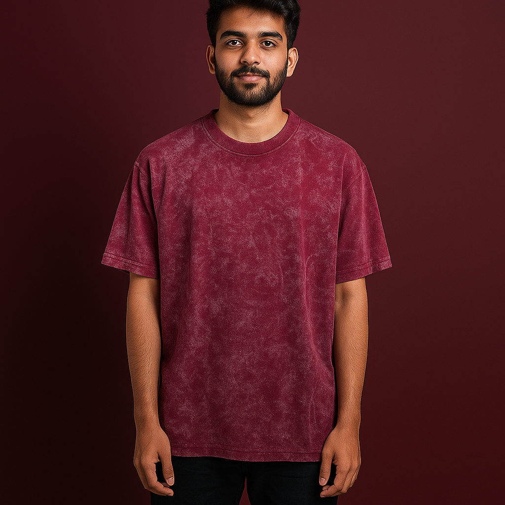 Model wearing an oversized acid wash t-shirt in brownish-red against a dark background.